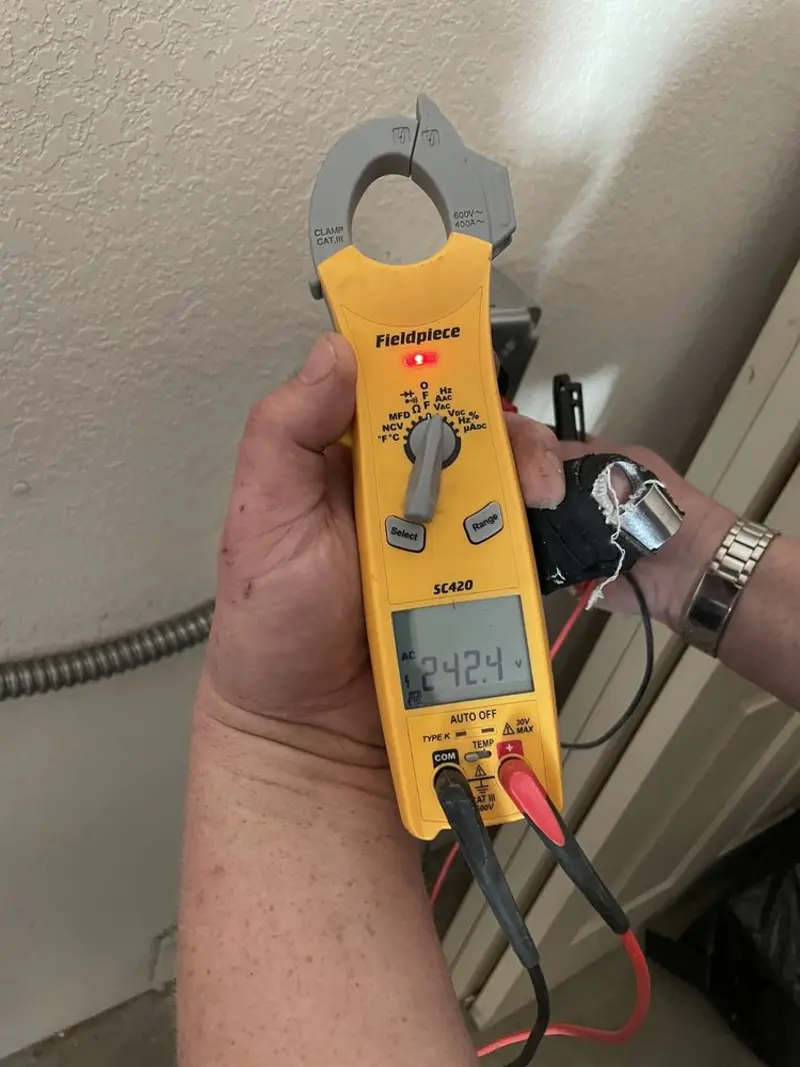Voltage testing with clamp meter during Electrical Installation Services in Longview